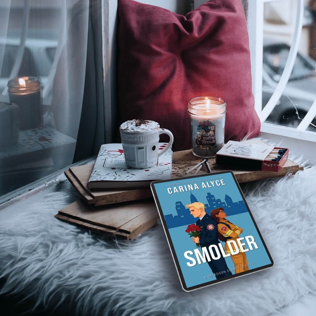 Tablet displaying a book cover with a cozy setting featuring a mug, candles, and books.