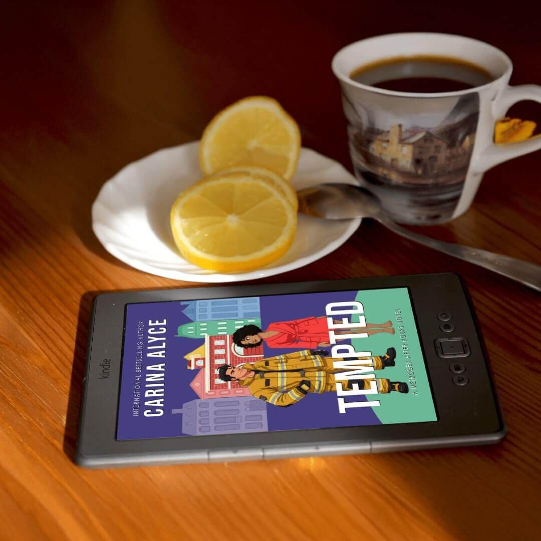 Phone displaying a book cover with a cup of coffee and lemon slices on a table