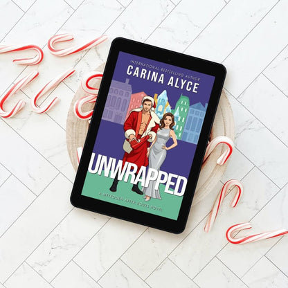 E-reader displaying the cover of 'Unwrapped' by Carina Alyce on a white wooden surface with candy canes.