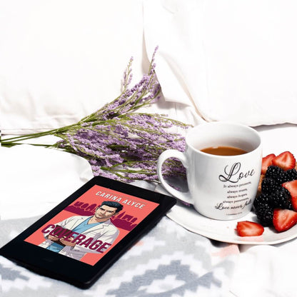 Tablet displaying a book cover with a mug of coffee, saucer with berries, and lavender on a white surface.
