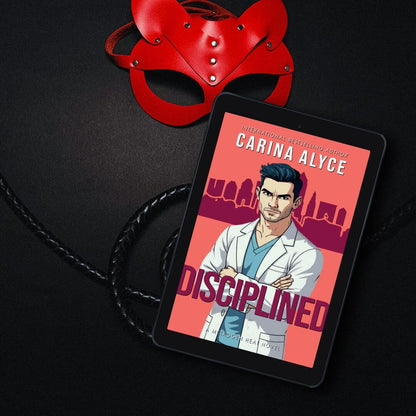E-reader displaying a book cover titled 'Disciplined' by Carina Alyce with a red mask in the background.